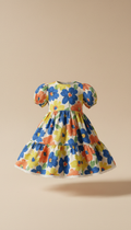 A stylish toddler dress displayed on a light-colored backdrop, such as moccasin. The dress is perfectly centered in the...